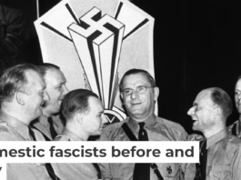 Fritz Kuhn, center, is congratulated by fellow officers of the German American Bund in New York on Sept. 3, 1938. AP Photo